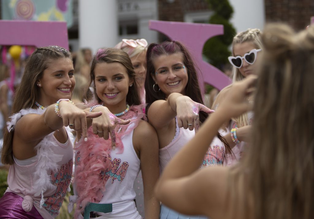 girls celebrate together with a photo on bid day.